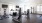 Large fitness space with various treadmills, ellipticals, and weight training equipment