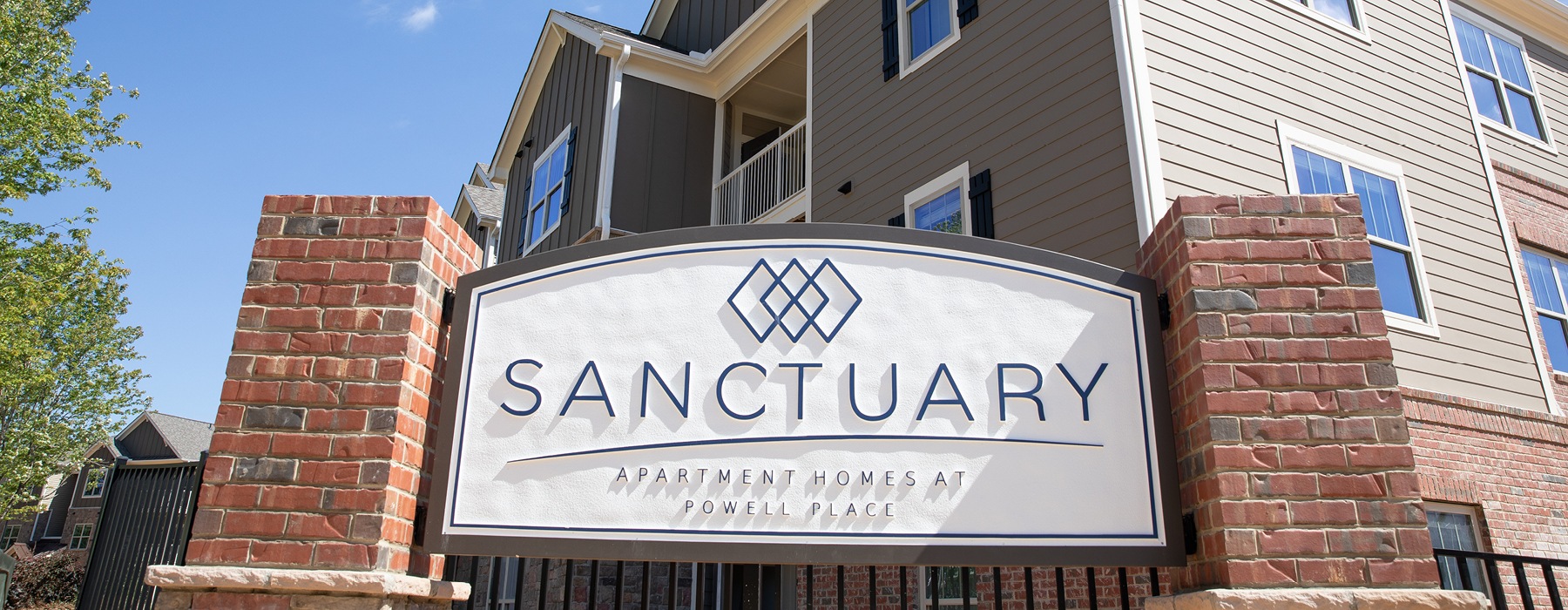 Sanctuary at Powell Place apartment sign